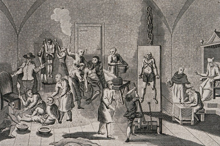 The interior of a prison of the Spanish Inquisition with a priest overseeing his scribe while men and women are hung from pulleys, tortured on the rack or burned with torches, The Spanish Inquisition was a council to combat heresy, authorised by a papal bull in 1478 and established by King Ferdinand II and Queen Isabella of the Crown, in 1480, Historical, digitally restored reproduction from a 19th century original. (Photo by: Bildagentur-online/Universal Images Group via Getty Images)