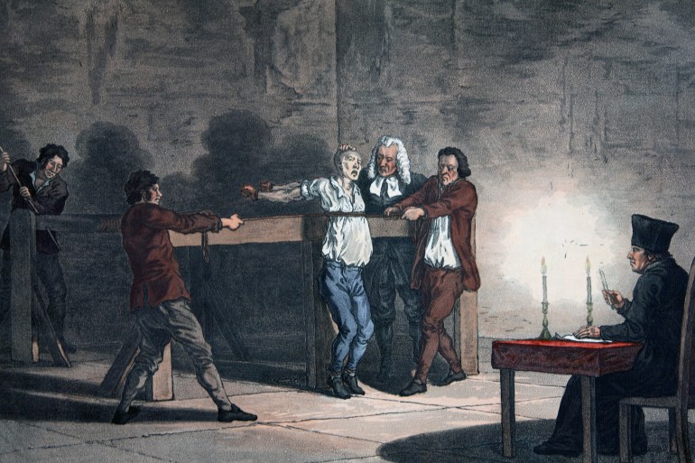 "One of four scenes of Inquisition torture: the victim is tied to a contrivance which winds a rope more and more tightly until his ribs are crushed. Engraved by L.C. Stadler, English artist, ca. 1813. Colored engraving. Located in a private collection. (Photo by © Historical Picture Archive/CORBIS/Corbis via Getty Images)"