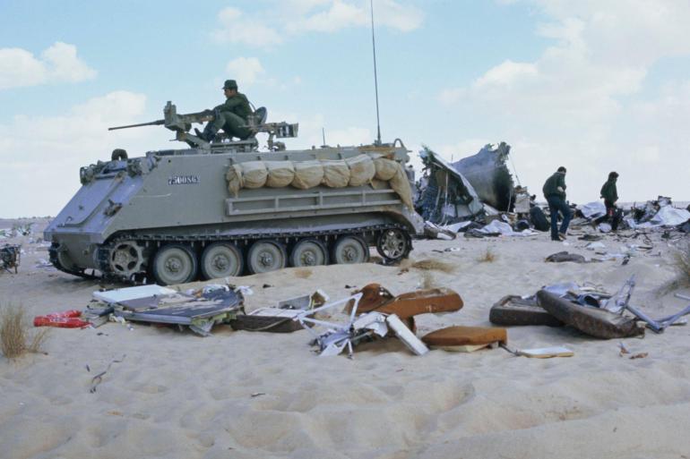 Israeli military personnel and an armoured personnel carrier guard the wreckage of the Libyan Arab Airlines Flight 114 (LN 114) that was shot down by two Israeli F-4 Phantom II fighter jets having entered Israeli-controlled airspace after flying off course due to bad weather and equipment failure, scattering wreckage over the Sinai Peninsula, Egypt, 22nd February 1973. The incident on flight LN 114 from Tripoli to Cairo via Benghazi killed 108 of the 113 people on board. (Photo by Bettmann Archive/Getty Images)