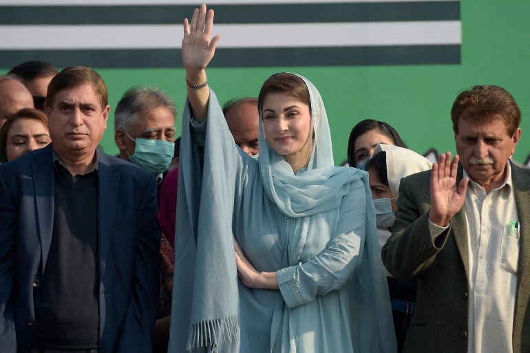 Maryam Nawaz (C), vice president Pakistan Muslim Leauge Nawaz (PML-N) and daughter of former premier Nawaz Sharif, waves to supporters†along with Pakistan-administered Kashmir Prime Minister Raja Farooq Haider Khan (R) and Kashmir assembly speaker Shah Ghulam Qadir (L) during the PML-N†Foundation Day†celebration in Islamabad on December 30, 2020.†††† (Photo by Farooq NAEEM / AFP)