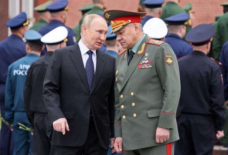 Russian President Vladimir Putin and Defence Minister Sergei Shoigu attend a wreath-laying ceremony, which marks the anniversary of the beginning of the Great Patriotic War against Nazi Germany in 1941, at the Tomb of the Unknown Soldier by the Kremlin wall in Moscow, Russia June 22, 2022. Sputnik/Mikhail Metzel/Kremlin via REUTERS ATTENTION EDITORS - THIS IMAGE WAS PROVIDED BY A THIRD PARTY.