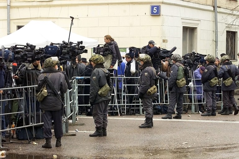 MOSCOW - OCTOBER 24: Soldiers of the Russian Ministry of Interior take position around the theatre that was seized by armed men early on October 24, 2002 in Moscow. Armed men entered the crowded Moscow theatre on Wednesday and took the audience hostage; the Federal Security Service said 